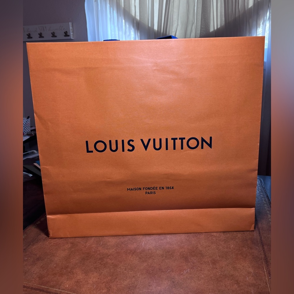 Louis Vuitton shopping bag.